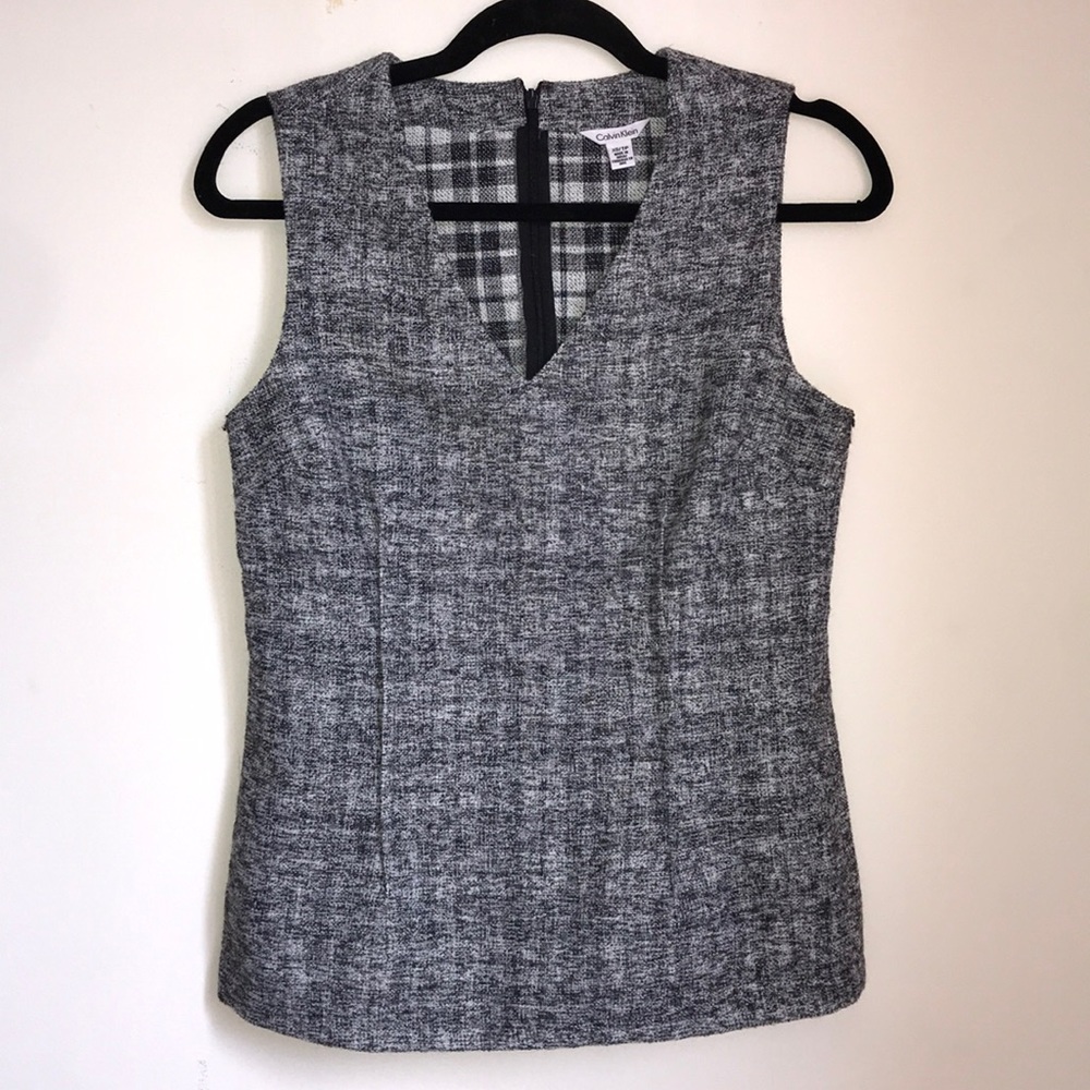 Grey peplum top by Calvin Klein